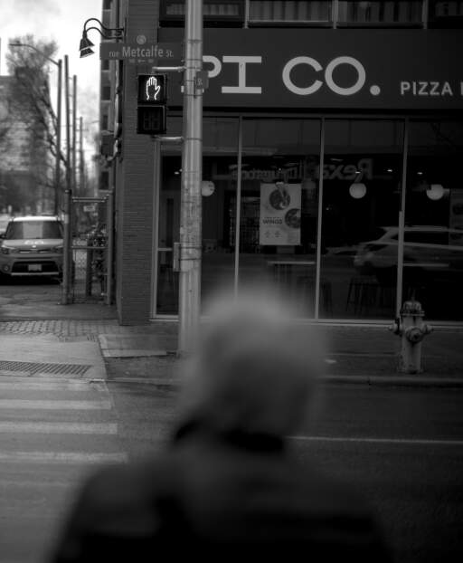 A old man waiting for the light